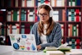 Young Woman Studying With Laptop In University Library Royalty Free Stock Photo
