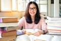 Young woman studying in library