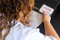 Young woman studying medicine sitting at a desk.