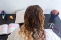 Young woman studying medicine sitting at a desk.