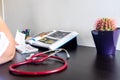 Young woman studying medicine sitting at a desk.