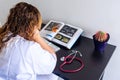 Young woman studying medicine sitting at a desk.