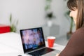 Young woman studying online at home.