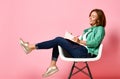 Young woman studying whith notepad in a chair Royalty Free Stock Photo