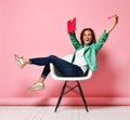 Young woman studying whith notepad in a chair Royalty Free Stock Photo