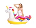 Young woman in stylish bikini with  unicorn inflatable ring on white background Royalty Free Stock Photo