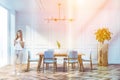 Young woman in stylish dining room interior Royalty Free Stock Photo