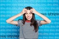 Young woman suffering from depression and words STRESS on background