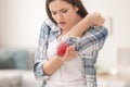 Young woman suffering from elbow pain