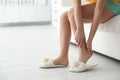 Young woman suffering from leg pain at home, closeup Royalty Free Stock Photo
