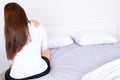 Young woman suffering neck and shoulder pain from uncomfortable bed. Healthcare medical or daily life concept Royalty Free Stock Photo