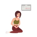 Young woman suffering from painful menstruation against calendar hanging on wall on background. Distressed girl sitting