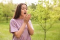 Young woman suffering from seasonal allergy outdoors Royalty Free Stock Photo