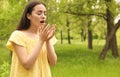 Young woman suffering from seasonal allergy outdoors Royalty Free Stock Photo