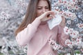 A woman suffers from allergies during the flowering period. Royalty Free Stock Photo