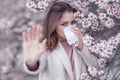 A woman suffers from allergies during the flowering period. Royalty Free Stock Photo