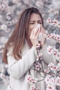 A woman suffers from allergies during the flowering period. Royalty Free Stock Photo