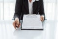 Young woman in suit in his office showing an insurance policy an Royalty Free Stock Photo