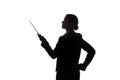 Young woman in suit shows pointer forward, side view - silhouette Royalty Free Stock Photo