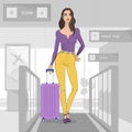 Young woman with a suitcase at the airport