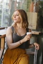 Young woman with suitcase on her coffee break Royalty Free Stock Photo