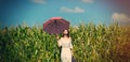 Young woman with suitcase and umbrella Royalty Free Stock Photo