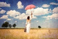 Young woman with suitcase and umbrella Royalty Free Stock Photo