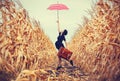 Young woman with suitcase and umbrella Royalty Free Stock Photo