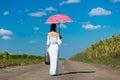 Young woman with suitcase and umbrella Royalty Free Stock Photo