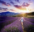 Young woman in summer day in lavender field Royalty Free Stock Photo