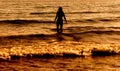 Young woman in summer dress standing in a sea Royalty Free Stock Photo