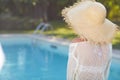 Young woman sun bathing in spa resort swiming pool Royalty Free Stock Photo