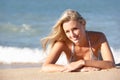 Young Woman Sunbathing On Beach Royalty Free Stock Photo