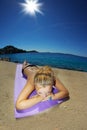 Young woman, sunbathing on a beach Royalty Free Stock Photo