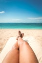 Young woman sunbathing on the beach Royalty Free Stock Photo