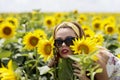 Young woman on a sunflowers field Royalty Free Stock Photo