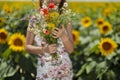 Young woman on a sunflowers field Royalty Free Stock Photo