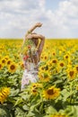 Young woman on a sunflowers field Royalty Free Stock Photo