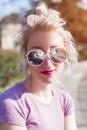Young woman with sunglasses portrait outdoors sunny