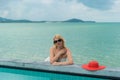 Young woman suntanning near pool Royalty Free Stock Photo