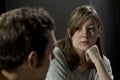 Young woman at a support group listening to man's testimony