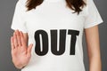 Young Woman Supporter Wearing T Shirt Printed With OUT Slogan