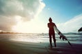 Woman surfer ready to surf on a beach