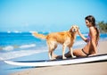 Young Woman Surfing with Her Dog