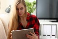 Young woman surfing the internet hold tablet in arms search information Royalty Free Stock Photo