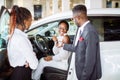 Young woman surprised by new car, gift for my beautiful wife Royalty Free Stock Photo