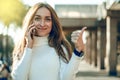 Young woman sweater in hand smartphone mobile phone talking on the phone Royalty Free Stock Photo