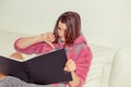 Upset teenage woman with notepad Royalty Free Stock Photo