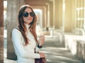 Young woman sweater sunglasses female red bag Royalty Free Stock Photo