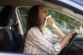 Young woman sweating suffer from heat drive car. Girl driver with heatstroke broken air conditioning